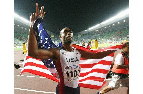 Gay draped in flag after claiming gold double with title in 200