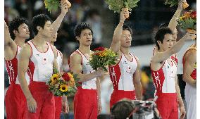 Japan takes silver in men's team event, China wins