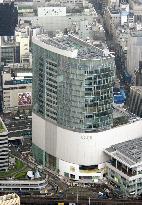 Old stores, new arrivals slug it out in Ginza shopping area