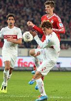 Stuttgart player Sakai in action against Bayern Munich