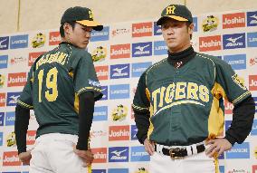 Hanshin Tigers players in green uniforms