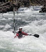 Canoe race on rapid-stream river in western Japan