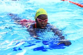 (SP)UGANDA-KAMPALA-PARALYMPIC SWIMMER-HUSNAH KUKUNDAKWE-TRAINING