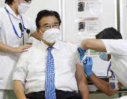 Japan health minister receives COVID-19 vaccine shot