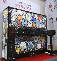 Piano decorated with ceramic ware tiles