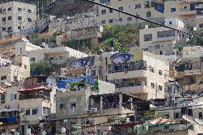 MIDEAST-JERUSALEM-SILWAN-MURALS