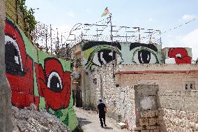 MIDEAST-JERUSALEM-SILWAN-MURALS