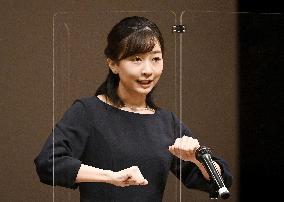 Princess Kako communicates in sign language