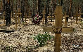Mass burial site in eastern Ukraine