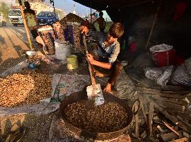 INDIA-ASSAM-NAGAON-PEANUTS-VENDOR