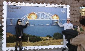 Stamp-like artwork featuring Crimea bridge blast