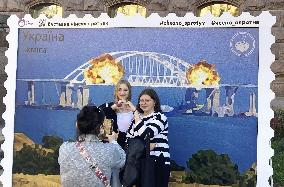 Stamp-like artwork featuring Crimea bridge blast