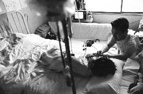 Death of a Second-Generation Atomic Bomb Victim