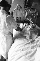 Death of a Second-Generation Atomic Bomb Victim