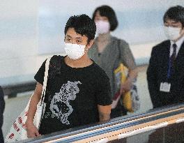 Japanese filmmaker detained in Myanmar returns home after amnesty