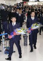 Japan football players return from World Cup in Qatar