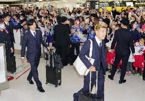 Japan football players return from World Cup in Qatar