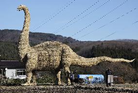 Giant straw artwork of dinosaur