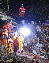 Rescue efforts continue for elderly couple after landslide