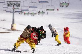 SLOVENIA-KRVAVEC-LION DANCE ON SNOWBOARD