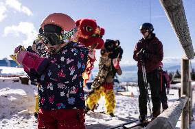 SLOVENIA-KRVAVEC-LION DANCE ON SNOWBOARD