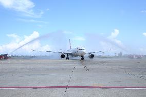 MALDIVES-MALE-CHINESE FLIGHT-TOURISTS-WATER CANNON SALUTE