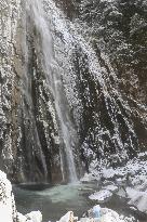 Frozen waterfall plunge pool in western Japan