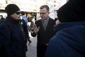 Chairperson of the National Coalition Party Petteri Orpo campaigns