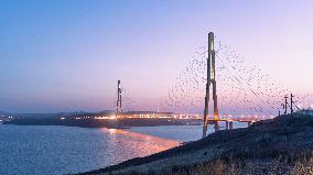 RUSSIA-VLADIVOSTOK-BRIDGE-SUNSET