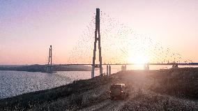 RUSSIA-VLADIVOSTOK-BRIDGE-SUNSET