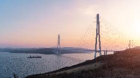 RUSSIA-VLADIVOSTOK-BRIDGE-SUNSET
