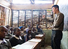 KENYA-NAIROBI-MATHARE SLUM-SCHOOL-BOOK READING