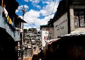 KENYA-NAIROBI-MATHARE SLUM-SCHOOL-BOOK READING