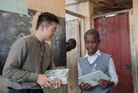 KENYA-NAIROBI-MATHARE SLUM-SCHOOL-BOOK READING