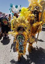 New Orleans Jazz & Heritage Festival Mardi Gras Indian Parade Participants March In Fair Grounds Race Course