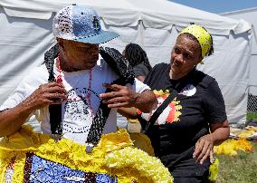 New Orleans Jazz & Heritage Festival Mardi Gras Indian Parade Participants March In Fair Grounds Race Course