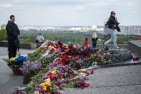 People Place Floral Tributes At The Tomb Of The Unknown Soldier Monument During Victory In WWII Day Commemorations In Kyiv