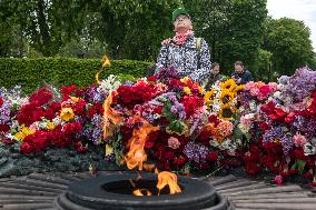 People Place Floral Tributes At The Tomb Of The Unknown Soldier Monument During Victory In WWII Day Commemorations In Kyiv