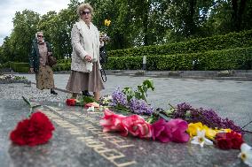 People Place Floral Tributes At The Tomb Of The Unknown Soldier Monument During Victory In WWII Day Commemorations In Kyiv