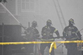 Two Houses Involved In A Multi-Alarm Large Fire In Paterson, New Jersey; Several Victims Including Firefighter Injured