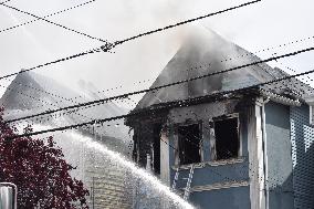 Two Houses Involved In A Multi-Alarm Large Fire In Paterson, New Jersey; Several Victims Including Firefighter Injured