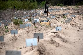 Mostly Unmarked Graves Of People Who Died In Kyiv Region