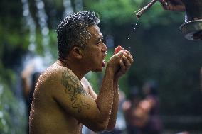 Balinese Perform Melukat Ritual To Celebrate Banyu Pinaruh