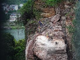 Workers Reinforced A Rock In Yichang