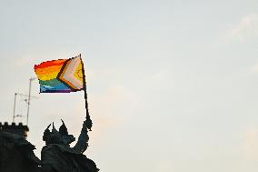 Progress Pride Flag Hung On A Statue