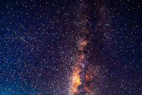 A Meteor Passing Over The Milky Way