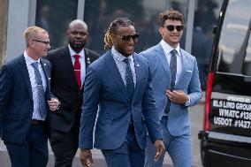 Kansas City Chiefs running back Isiah "Pop" Pacheco and quarterback Patrick Mahomes walk to the White House