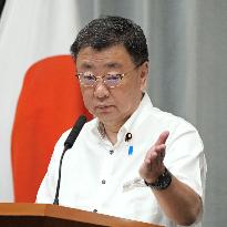 Japan gov't top spokesman in Okinawa shirt
