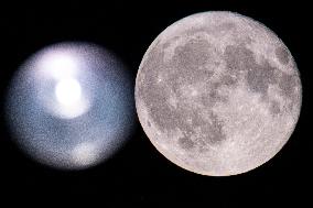 Strawberry Full Moon Rises Over The Netherlands