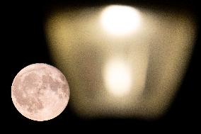 Strawberry Full Moon Rises Over The Netherlands